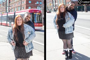 Two vertical side by side photos of a many behind a woman with his arms around her waist. In the one on the left a red and white Toronto streetcar is behind them. They are looking at the camera and smiling. They are both wearing jean jackets. Hers is open. Man is black, woman is Metis with red hair and a fair complexion