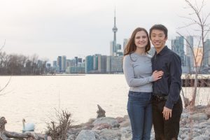 Couple in front of Toronto cityscape and Lake Ontario.
